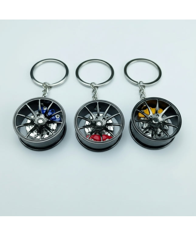 Black metal automotive wheel keychain - blue, red, or yellow caliper