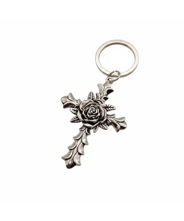Silver keychain with cross charm covered with rose design