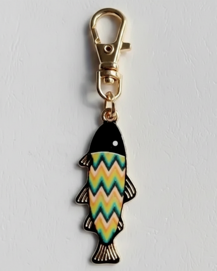 Keychain with Fish Shaped Charm with green, yellow, orange, pink, and black zigzag pattern