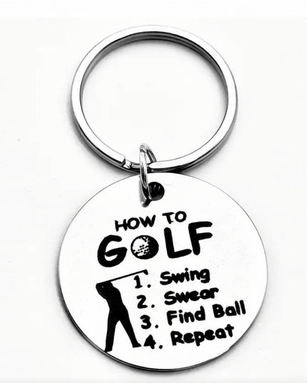 Keychain with humorous golf-themed text on a white background