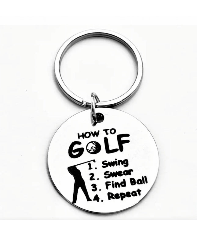Keychain with humorous golf-themed text on a white background