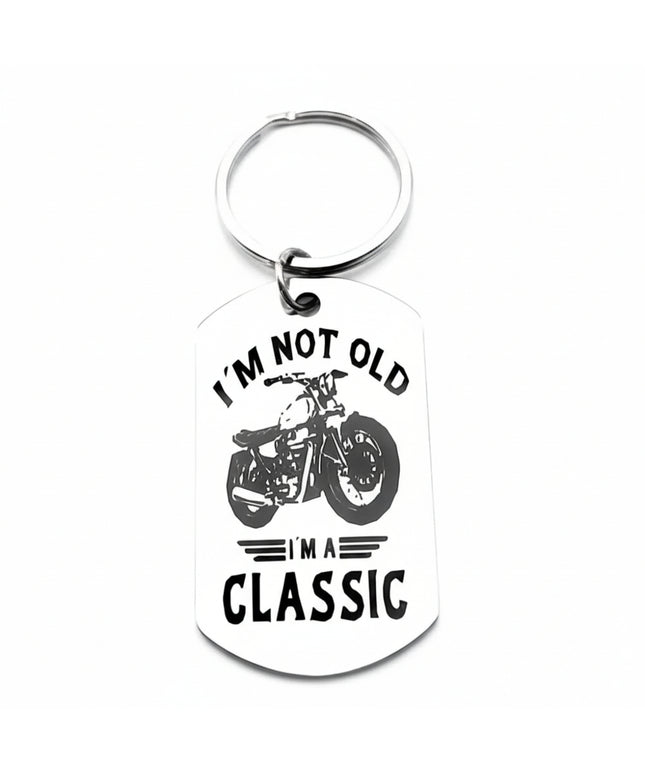 Keychain with motorcycle graphic and text 'I'm not old, I'm a classic' on a white background