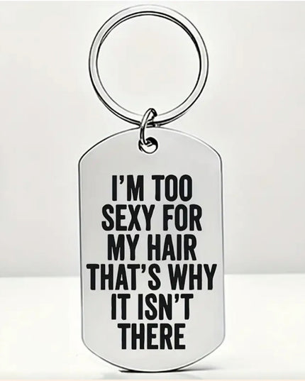 Silver keychain that reads "I'm Too Sexy For My Hair That's Why It Isn't There" in black font