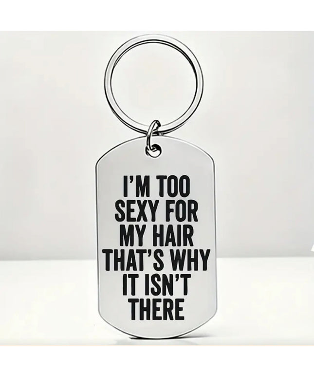 Silver keychain that reads "I'm Too Sexy For My Hair That's Why It Isn't There" in black font