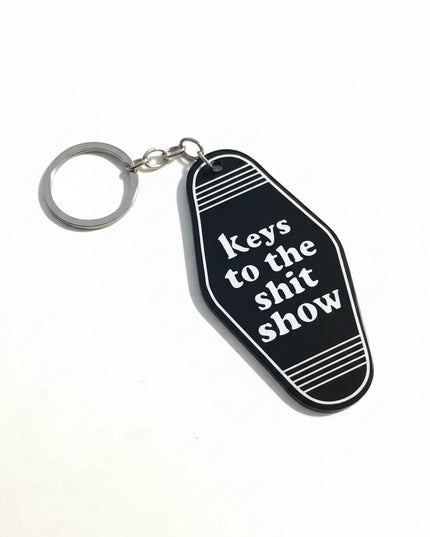 Black keychain tag with "Keys to the Sh*t Show"