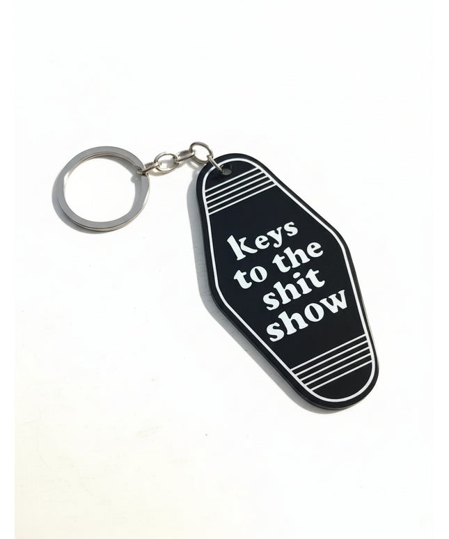 Black keychain tag with "Keys to the Sh*t Show"