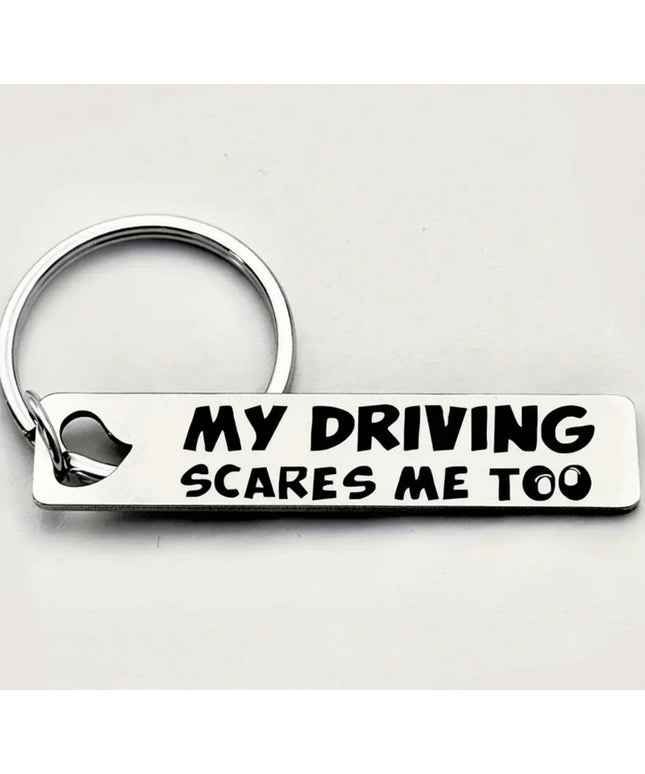 Keychain with 'My Driving Scares Me Too' text on a white background