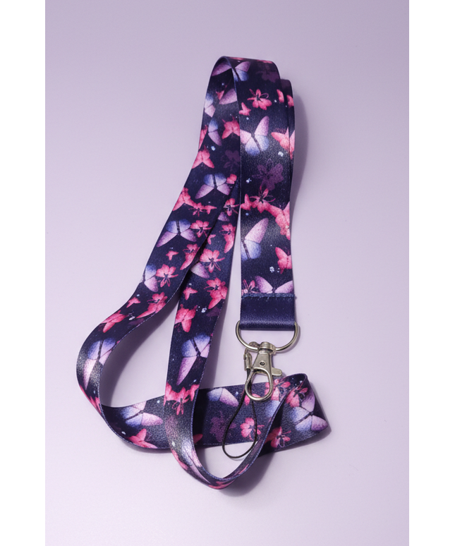 Navy blue lanyard with pink and purple butterflies with lobster clasp and phone charm loop