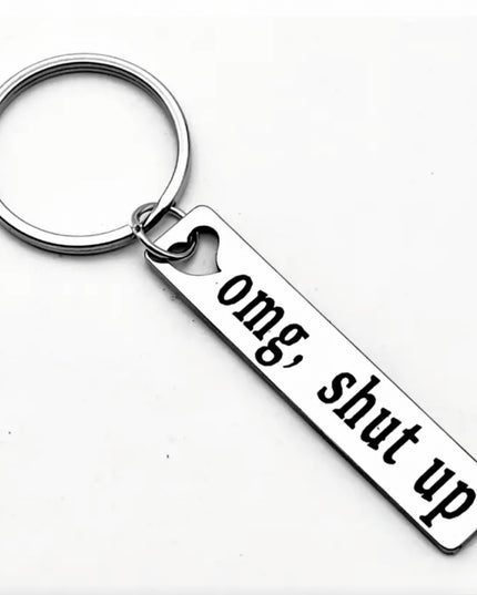 Keychain with 'omg, shut up' tag on a white background
