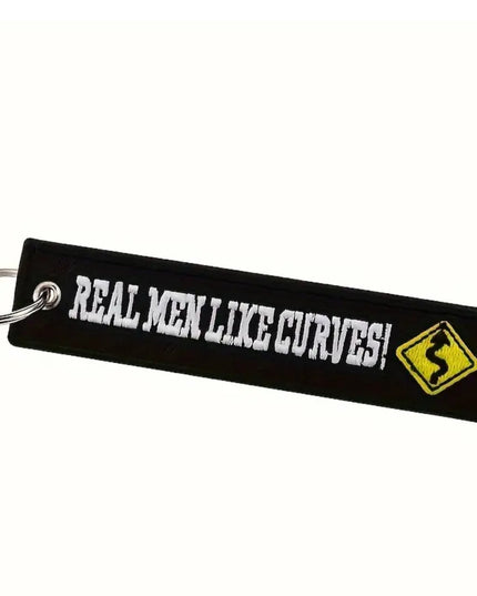 Embroidered Keychain and tag with "Real Men Like Curves" and a yellow curve traffic sign