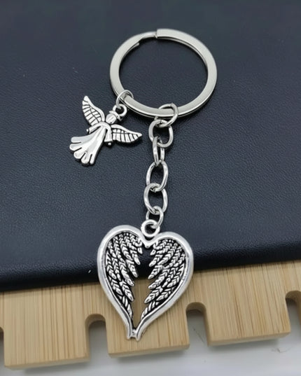 Silver key ring with angel wing and flying angel charms