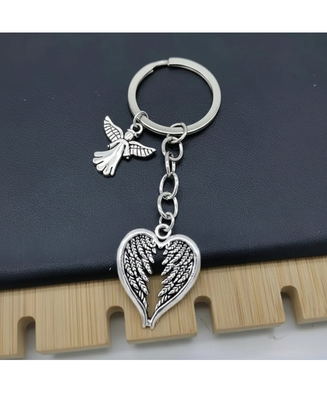 Silver key ring with angel wing and flying angel charms