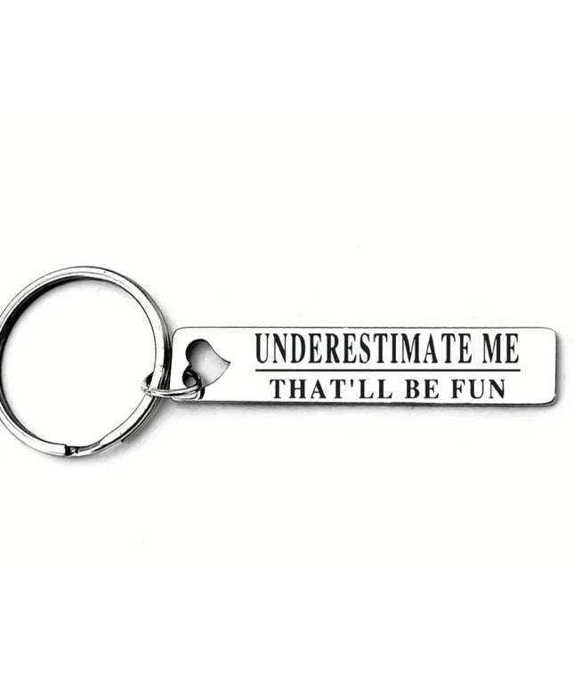 Keychain with 'Underestimate Me That'll Be Fun' text on a white background