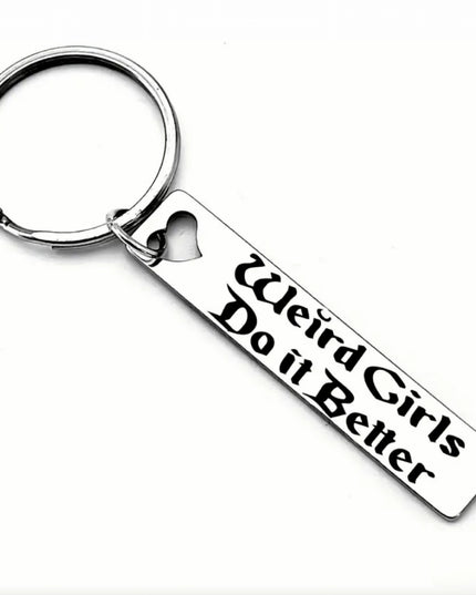 Keychain with 'Weird Girls Do it Better' text on a white background