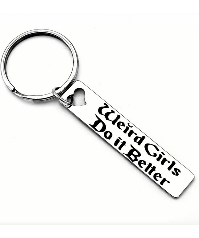 Keychain with 'Weird Girls Do it Better' text on a white background