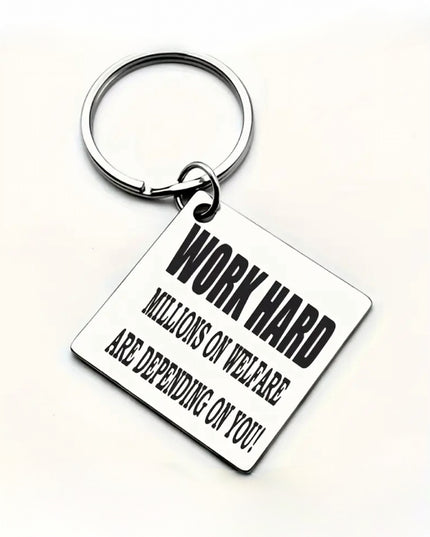 Square silver keychain that reads "Work Hard Millions on Welfare are Depending on You" in black font